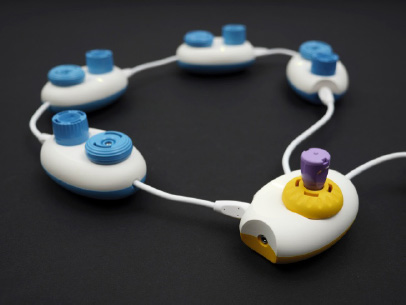 A photo showing a Code Jumper program with four Play pods, one Loop pod, and one Constant plug.