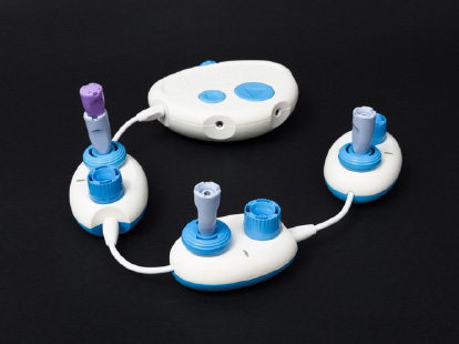 A photo of a Code Jumper program with three Play pods, three Variable plugs, and one Constant plug.